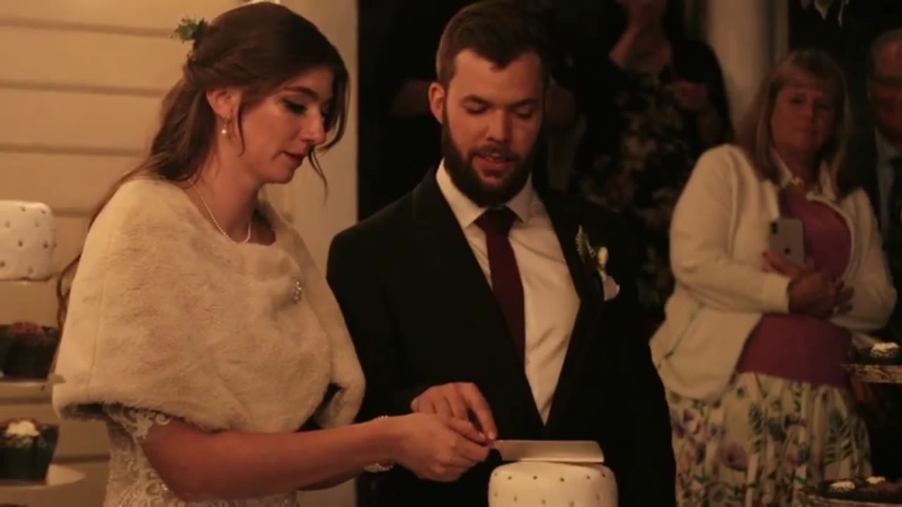 Wedding film clip: the couple cutting their cake